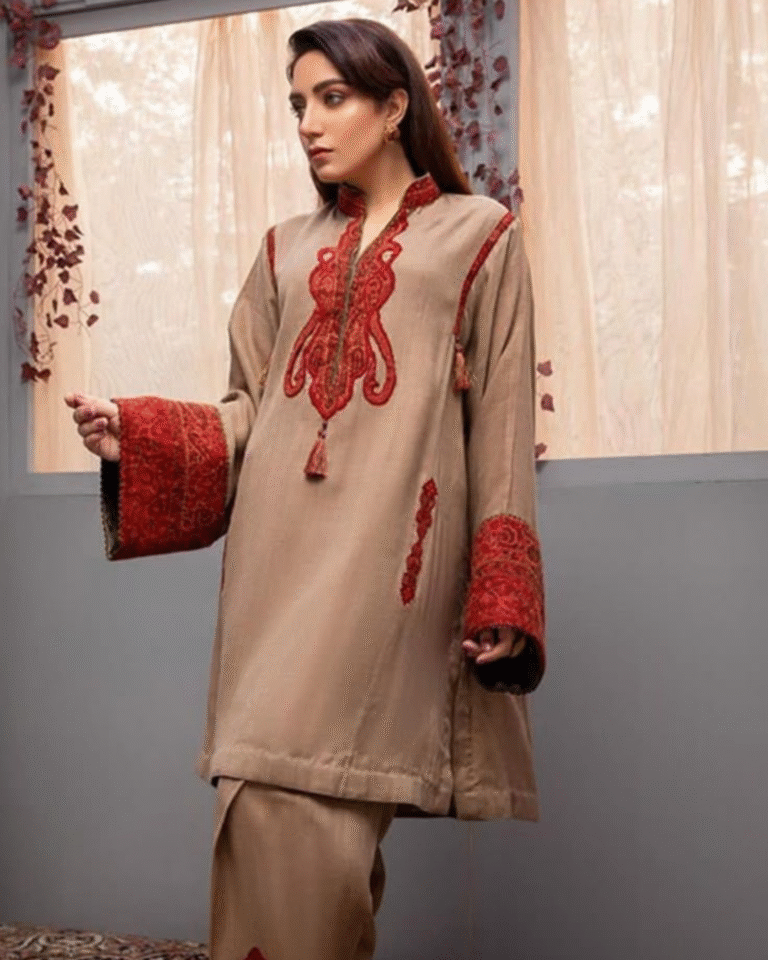 A detailed, close-up image showcasing a luxurious, deep brown, satin or silk-blend co-ord set. The garment features fine multicolored hand embroidery on the front placket and yoke, with unique drawstring detailing on the sleeves. Ideal for e-commerce listings for festive ethnic wear, Indo-Western fusion outfits, and embroidered silk sets.