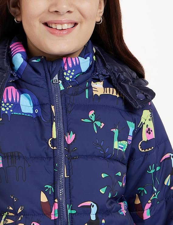 Colorful Kids Animal Print Puffer Jacket Kids navy puffer jacket with colorful animal print (llamas, zebras, cats) and hood, worn by a smiling young girl.