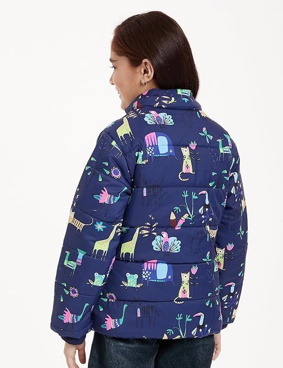 Girls Navy Puffer Jacket - Colorful All-Over Animal Print Back view of a young girl wearing a navy blue puffer jacket featuring a colorful all-over safari animal print (elephants, giraffes, cats), suitable for girls' winter wear.