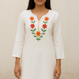 Minimalist white cotton straight kurta for women, featuring bright orange and red floral thread embroidery on the V-neck yoke, paired with matching white cotton pants.